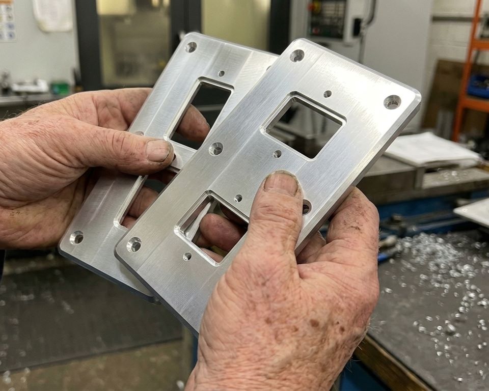 Machined aluminium equipment fascia plates with milled cut-outs and engraved labels